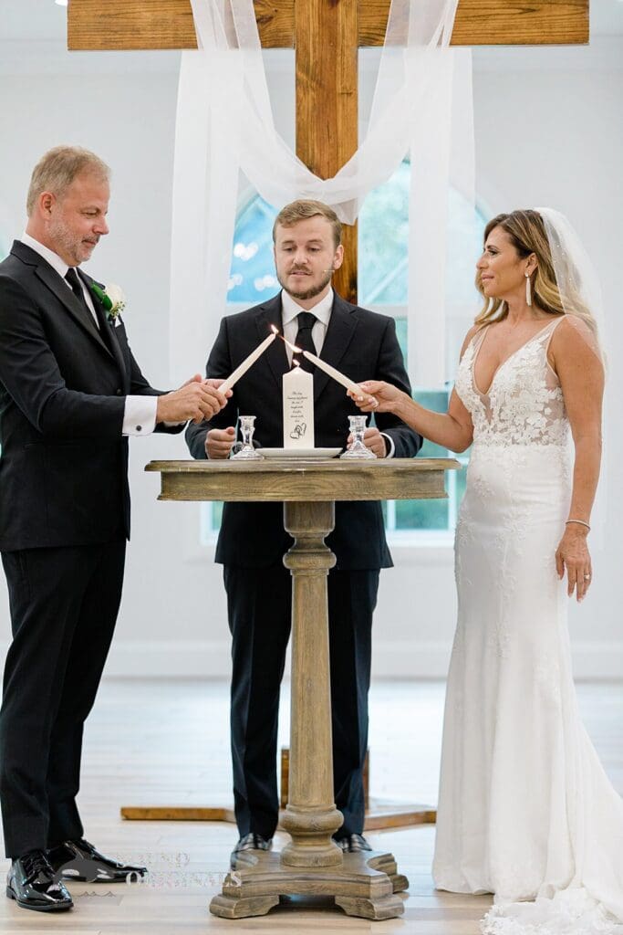 Harborside Chapel Wedding Bride and groom light their cancles during the Harborside Chapel Wedding