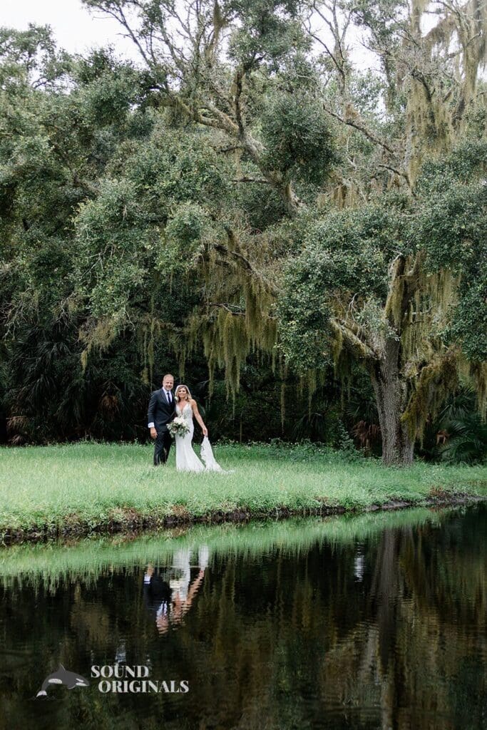 Harborside Chapel Wedding Newlyweds on the lush grounds of the Harborside Chapel Wedding