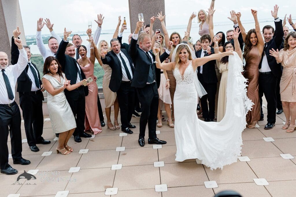 Harborside Chapel Wedding Cheering Harborside Chapel Wedding guests with the newlyweds