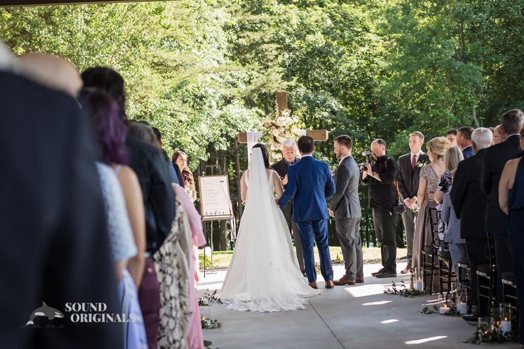 The bride and groom at the altar of The Oakley on the Lake Wedding