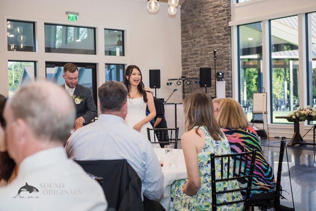 THe bride and groom mingle with their guests at The Oakley on the Lake Wedding
