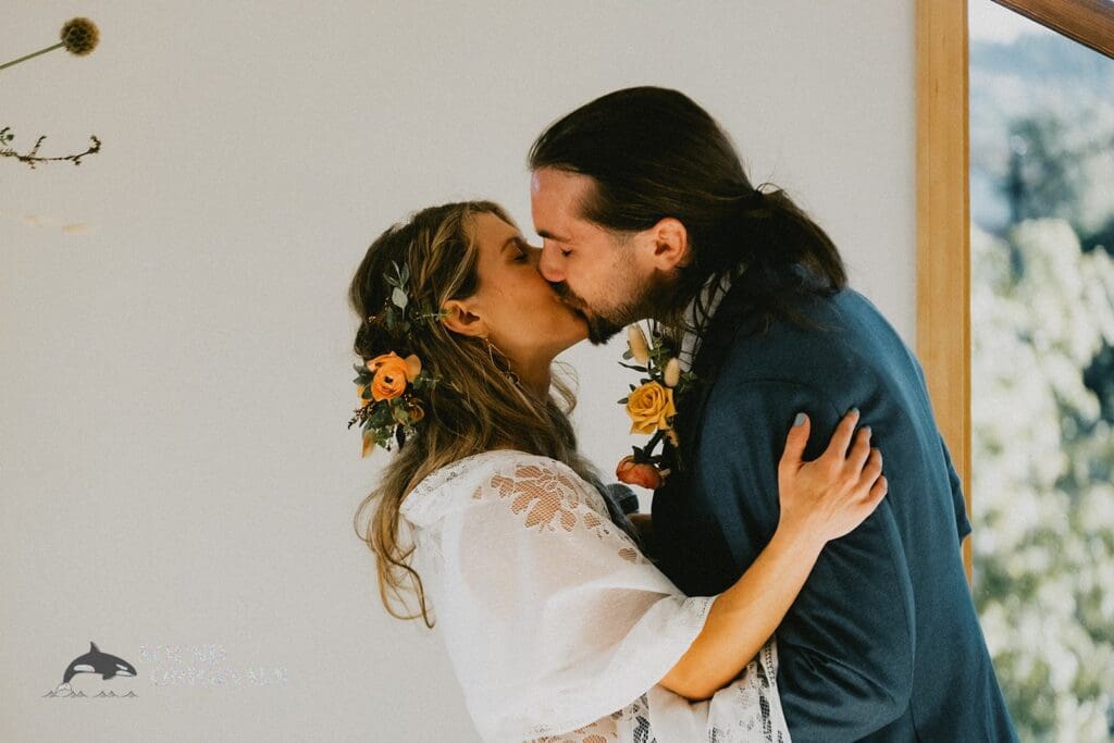 Pretty bride and groom share a mouthwatering kiss in a Rembrandt Yard Wedding