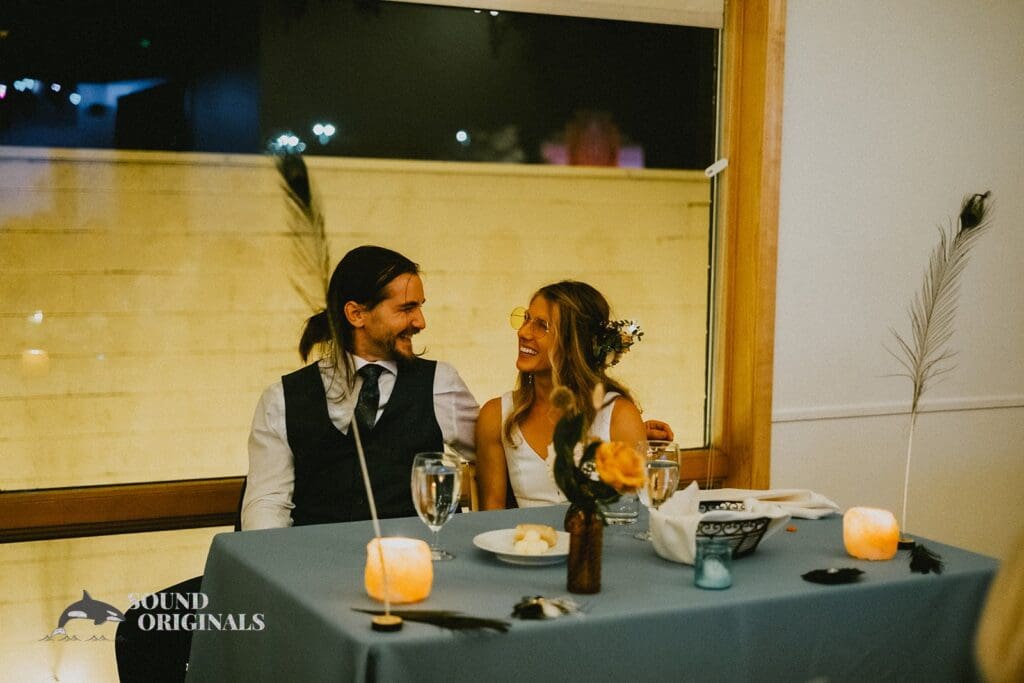 Photographer captures beautiful couple on the couple seats in a Rembrandt Yard Wedding