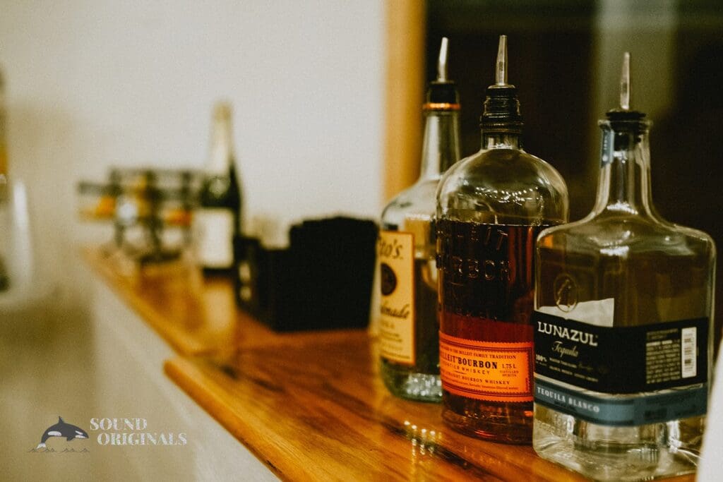 Classic bottles of wine sit pretty in a Rembrandt Yard Wedding