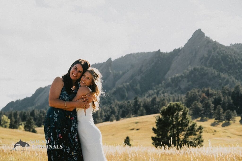Beautiful time bride takes a lovely shot with beautiful sister in Rembrandt Yard outdoor space