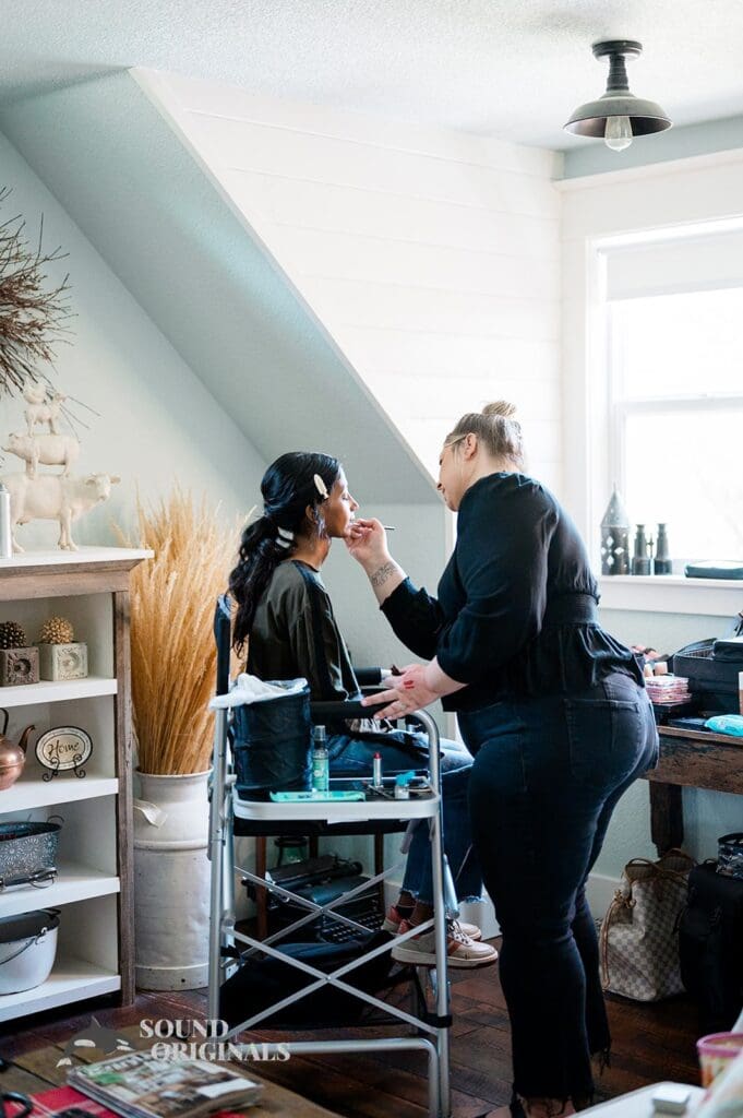 Bride getting makeup done ready for The Red Farmhouse Bed & Breakfast Wedding