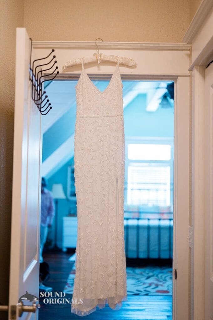 Wedding dress hanging at The Red Farmhouse Bed & Breakfast Wedding
