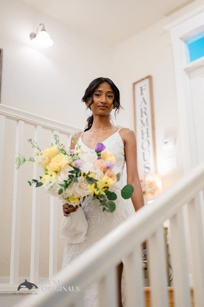 The bride holding her bouquet at The Red Farmhouse Bed & Breakfast Wedding