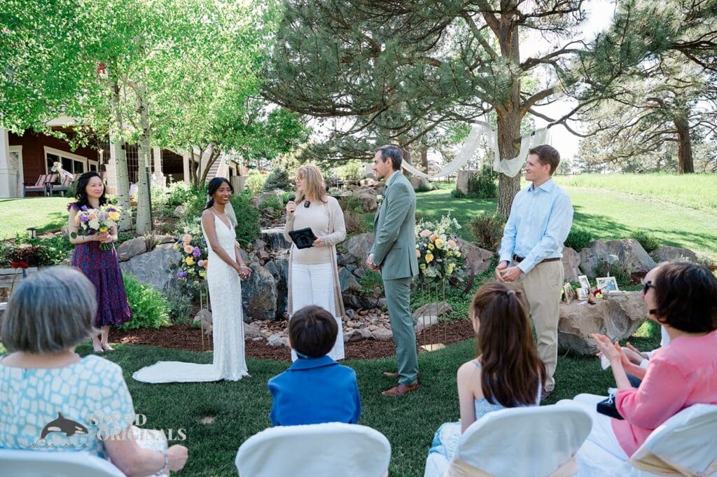 The bride, groom, bridal party and officiant at The Red Farmhouse Bed & Breakfast Wedding