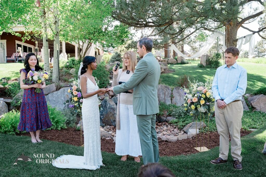 The officiant talking at The Red Farmhouse Bed & Breakfast Wedding