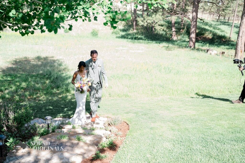 Romantic photo of the bride and groom leaving their The Red Farmhouse Bed & Breakfast Wedding ceremony
