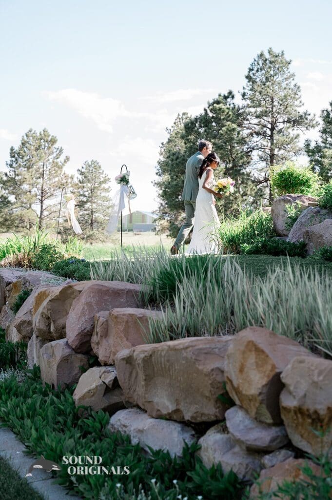 Artistic photo of the bride and groom leaving The Red Farmhouse Bed & Breakfast Wedding ceremony