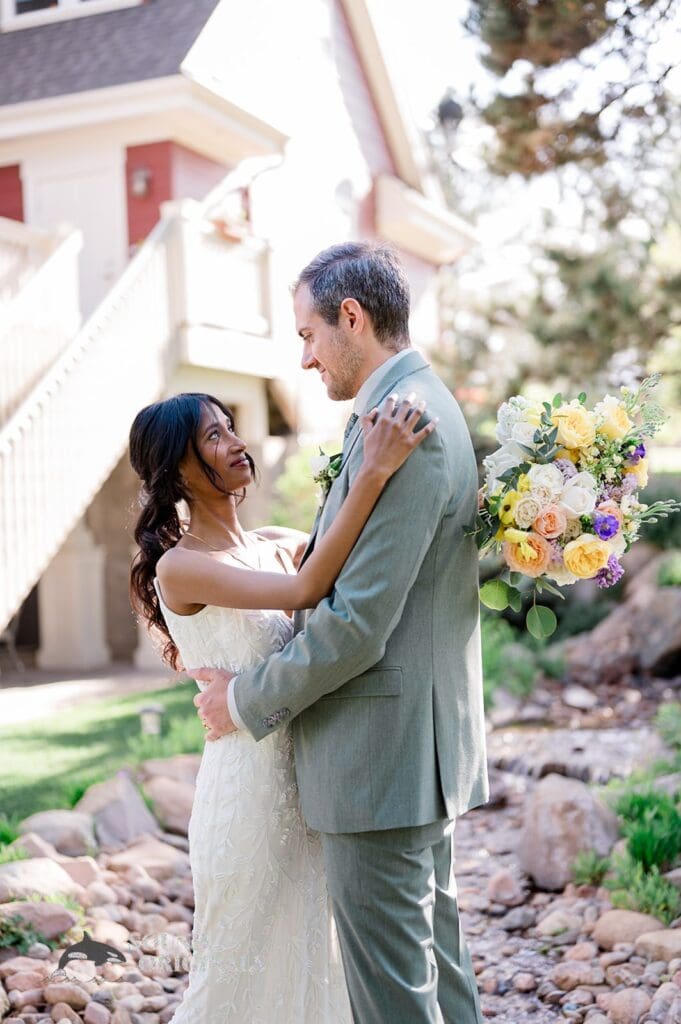 Wedding photographer captures gorgeous photo of bride and groom outside The Red Farmhouse Bed & Breakfast