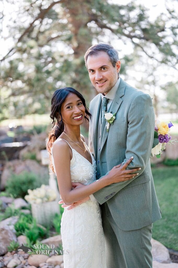 Beautiful portrait photo of bride and groom outside The Red Farmhouse Bed & Breakfast