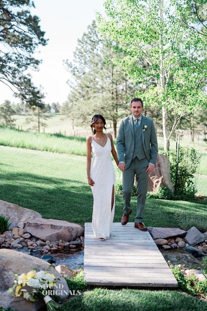 Husband and wife walking side by side at The Red Farmhouse Bed & Breakfast Wedding