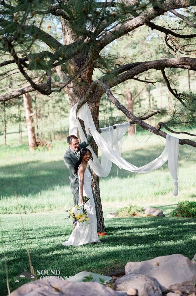 Bride and groom enjoying the grounds of The Red Farmhouse Bed & Breakfast Wedding