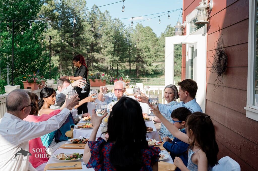 Saying cheers to the happy couple at The Red Farmhouse Bed & Breakfast Wedding