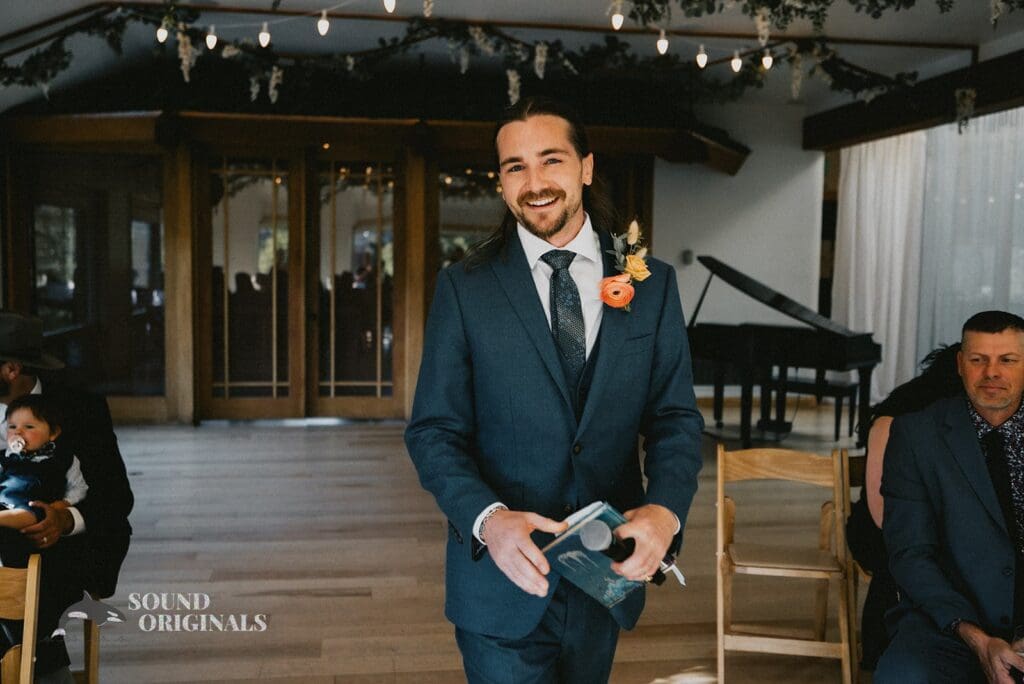 Photographer captures Handsome groom in the Rembrandt Yard ceremony hall