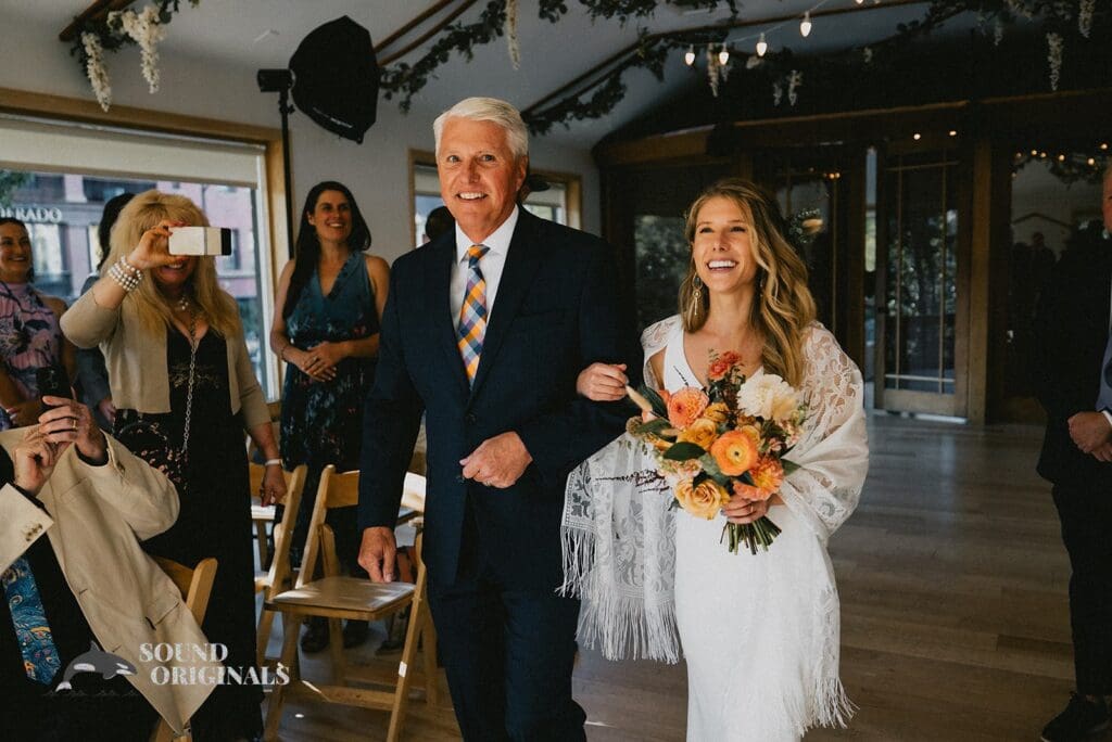 Moment handsome dad walks pretty bride in for a Rembrandt Yard Wedding