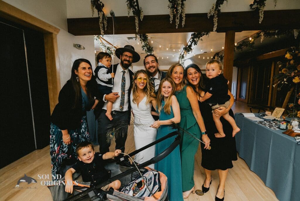 Bride and family pose for a beautiful shot in a Rembrandt Yard Wedding