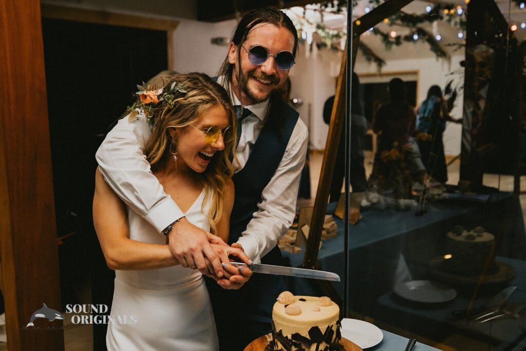 Moment bride and groom are ready to cut the cake in a Rembrandt Yard Wedding