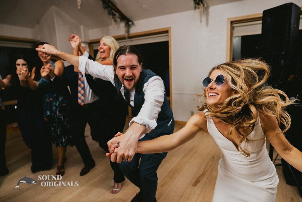 Happy husband and wife vibe to music in Rembrandt Yard Wedding