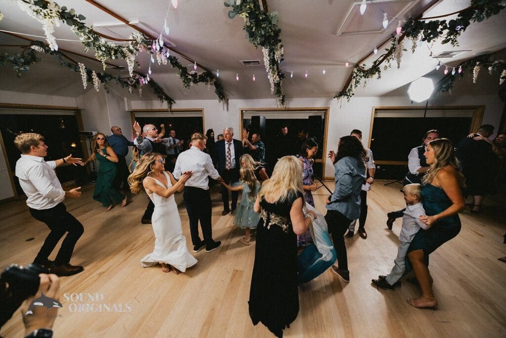 Happy bride and guests in a dance in the Rembrandt Yard Wedding reception