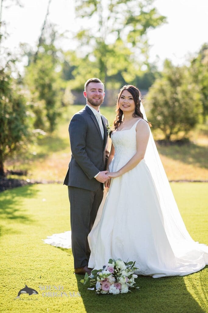 Beautiful portrait of husband and wife at The Oakley on the Lake Wedding