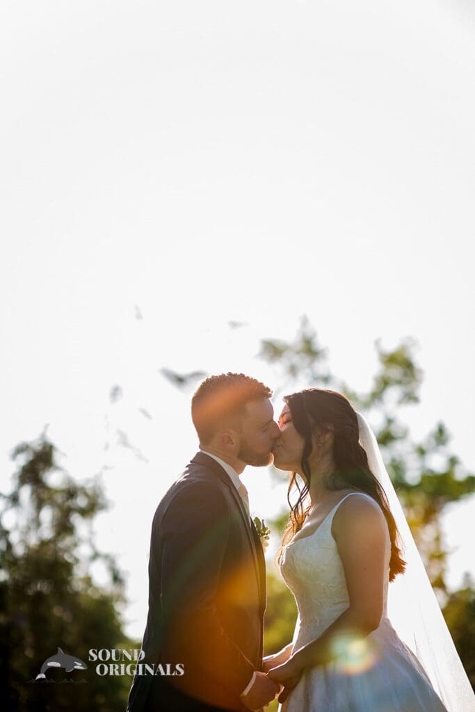 Newlyweds share a kiss at The Oakley on the Lake Wedding