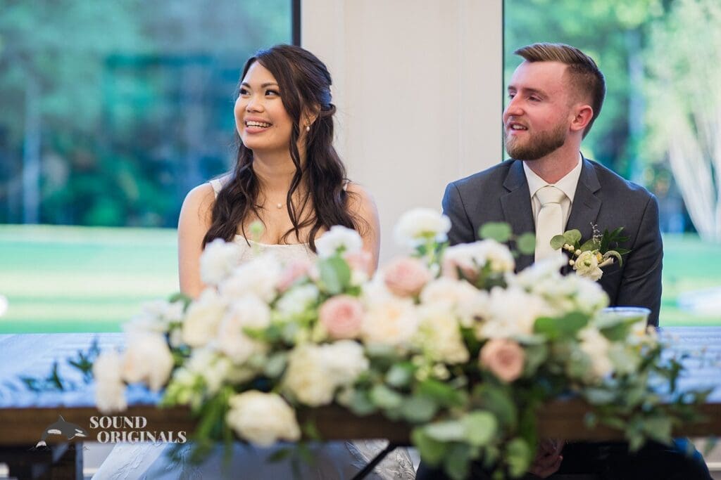 The bride and groom at the top table of The Oakley on the Lake Wedding