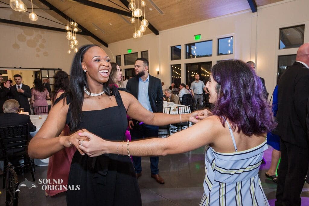Friends dancing at The Oakley on the Lake Wedding