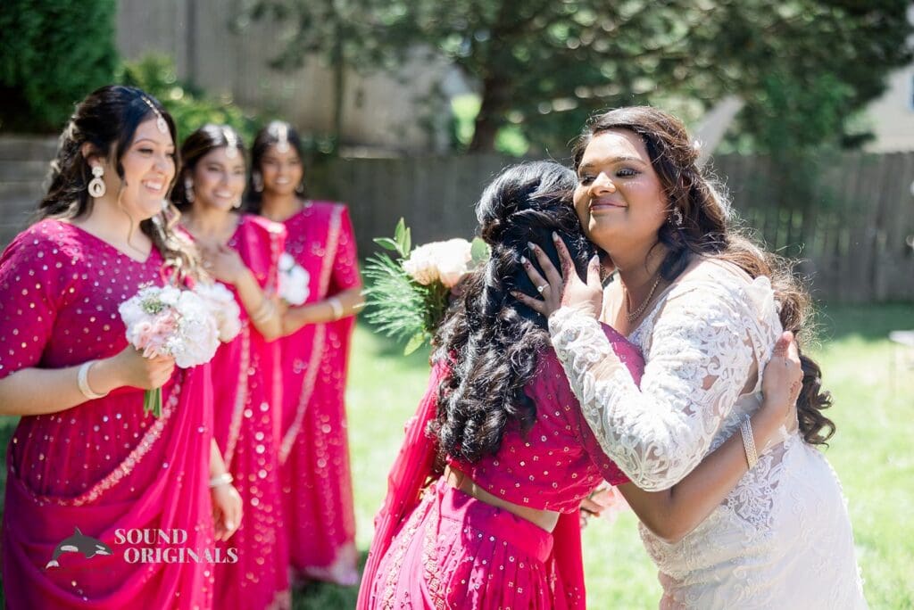 The bride having special moments with her bridesmaids before the Embassy Suites by Hilton Naperville Wedding