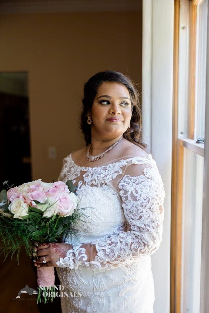 The bride with her flowers at Embassy Suites by Hilton Naperville Wedding