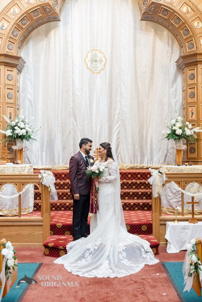 The happy couple at the altar of their Embassy Suites by Hilton Naperville Wedding