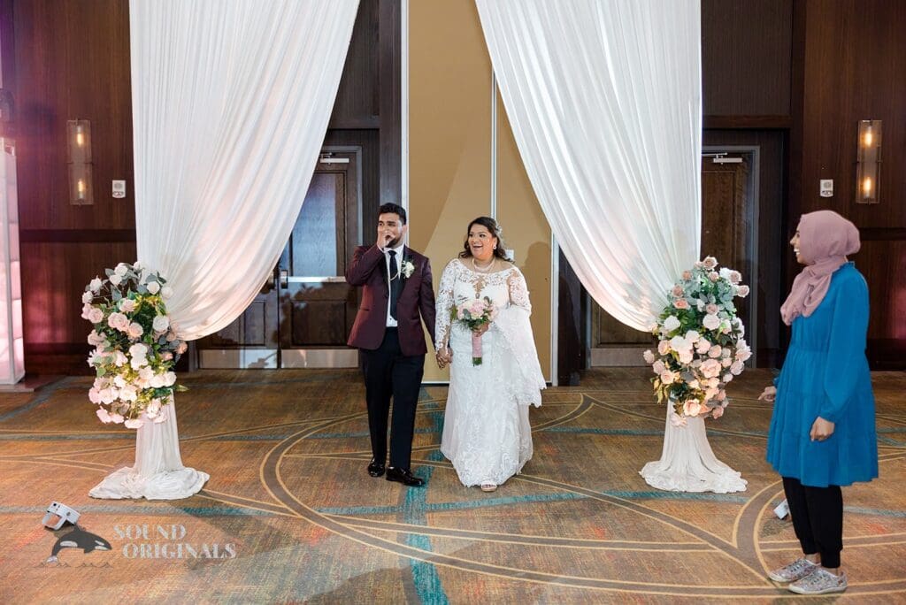 Entrance of the bride and groom at the Embassy Suites by Hilton Naperville Wedding