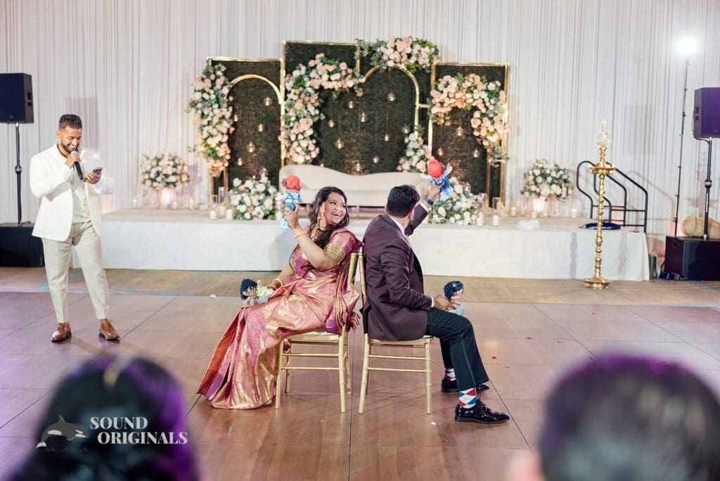 The bride and groom enjoying the speeches at their Embassy Suites by Hilton Naperville Wedding