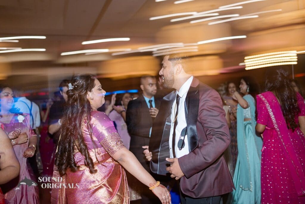 The bride and groom on the dance floor at their Embassy Suites by Hilton Naperville Wedding