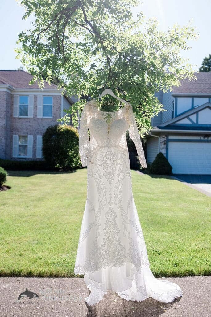 White dress hands outside house near Embassy Suites by Hilton Naperville