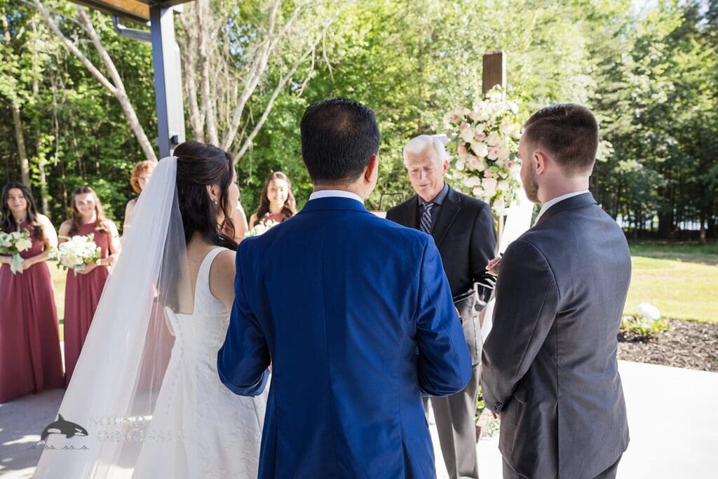 The bride's father giving her away at The Oakley on the Lake Wedding