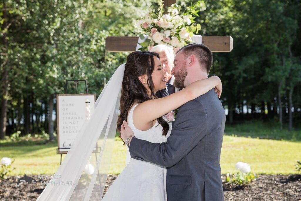 Husband and wife share first kiss at The Oakley on the Lake Wedding