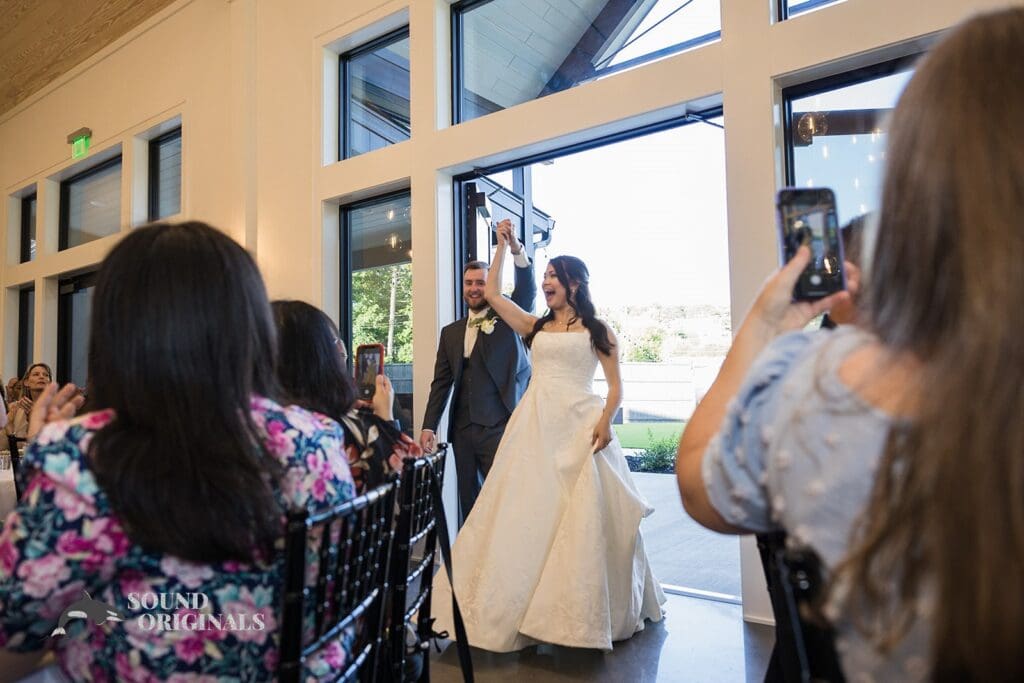 The bride and groom arrive to The Oakley on the Lake Wedding reception