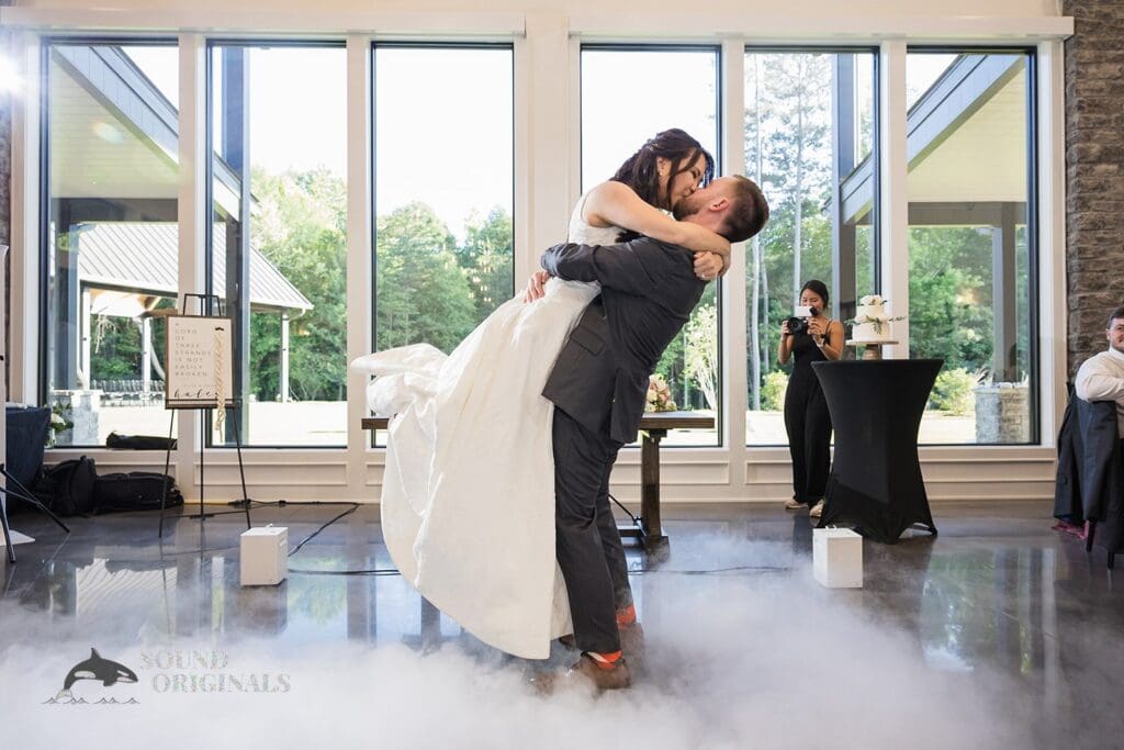 The groom lifts the bride up during first dance at The Oakley on the Lake Wedding