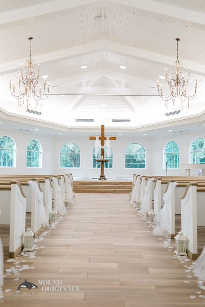 Harborside Chapel Wedding White and rustic interiors of the Harborside Chapel Wedding