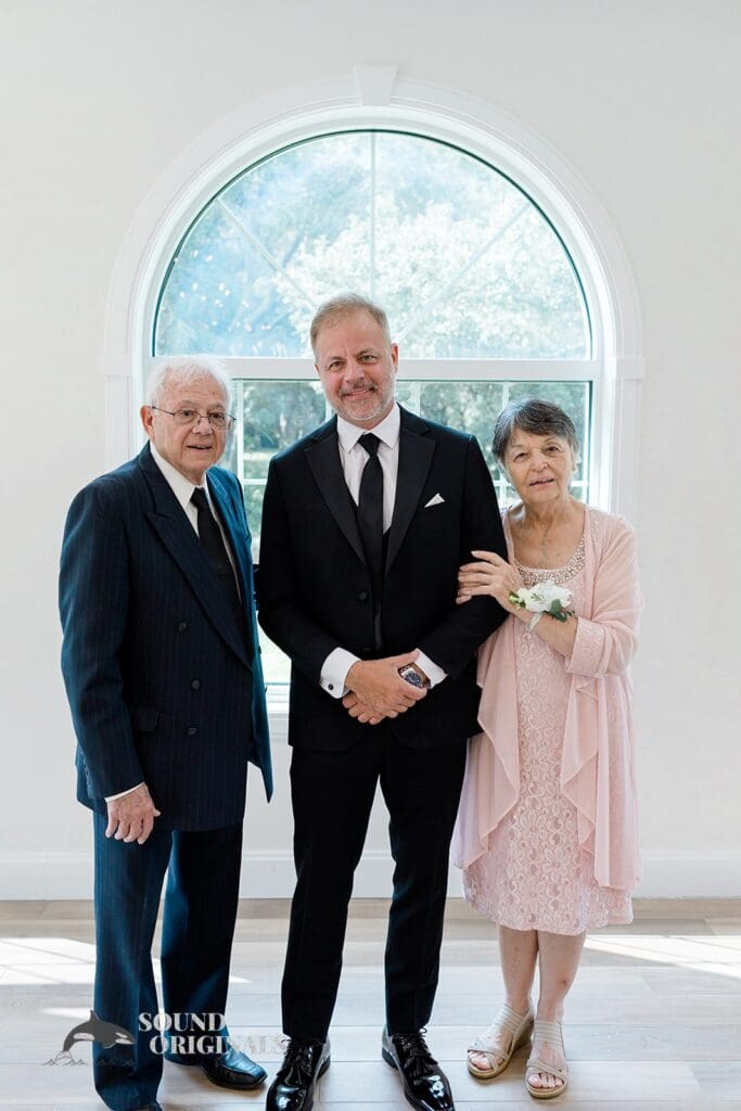 Harborside Chapel Wedding Groom with family at the Harborside Chapel Wedding