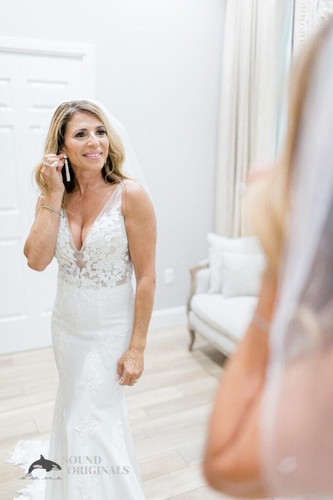 Harborside Chapel Wedding Bride checking herself in the mirror during the Harborside Chapel Wedding