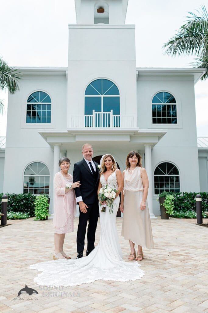 Harborside Chapel Wedding Newlyweds with some family members at Harborside Chapel Wedding