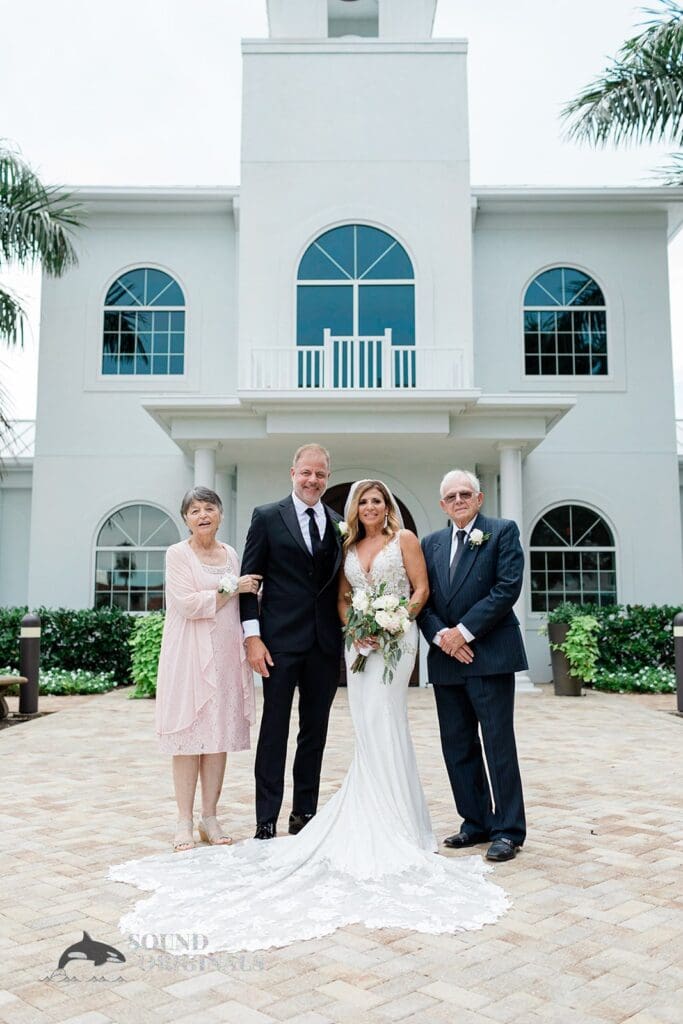 Harborside Chapel Wedding Newlyweds with groom's family at the Harborside Chapel Wedding