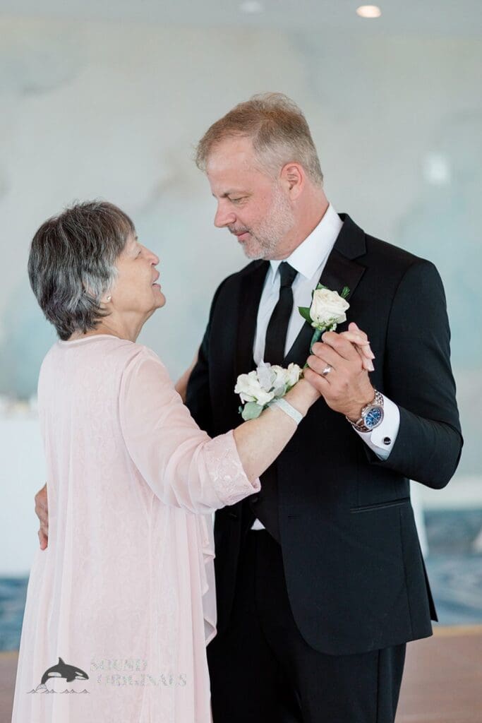 Harborside Chapel Wedding GRoom and his mom dance after the Harborside Chapel Wedding