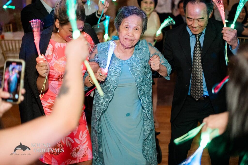 Guests enjoying glow sticks at The Abbington Distinctive Banquets Wedding