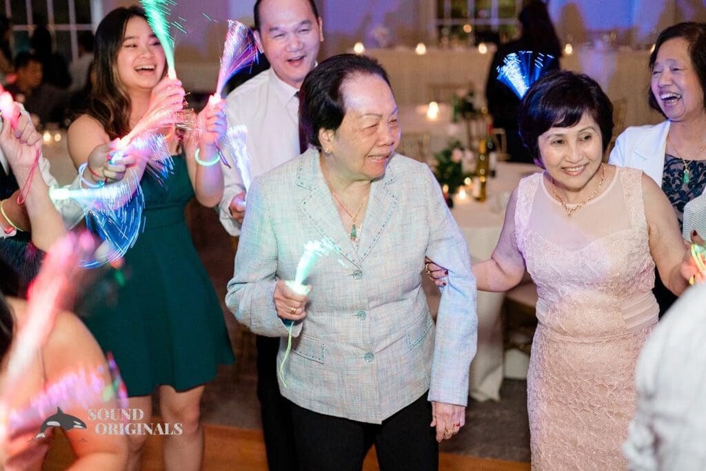Guests with glow sticks at The Abbington Distinctive Banquets Wedding